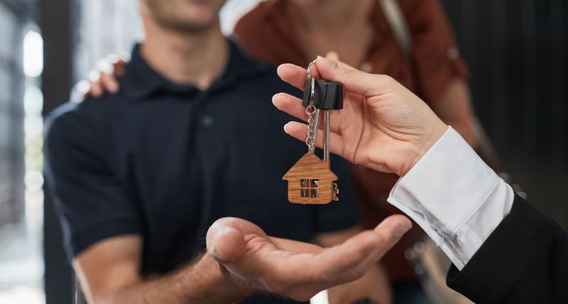 a conveyancing solicitor handing over the keys in the UK